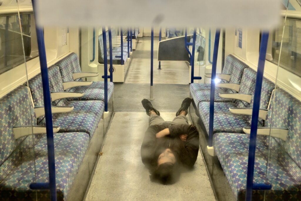 London Street Photography Lockdown Man Asleep on Underground