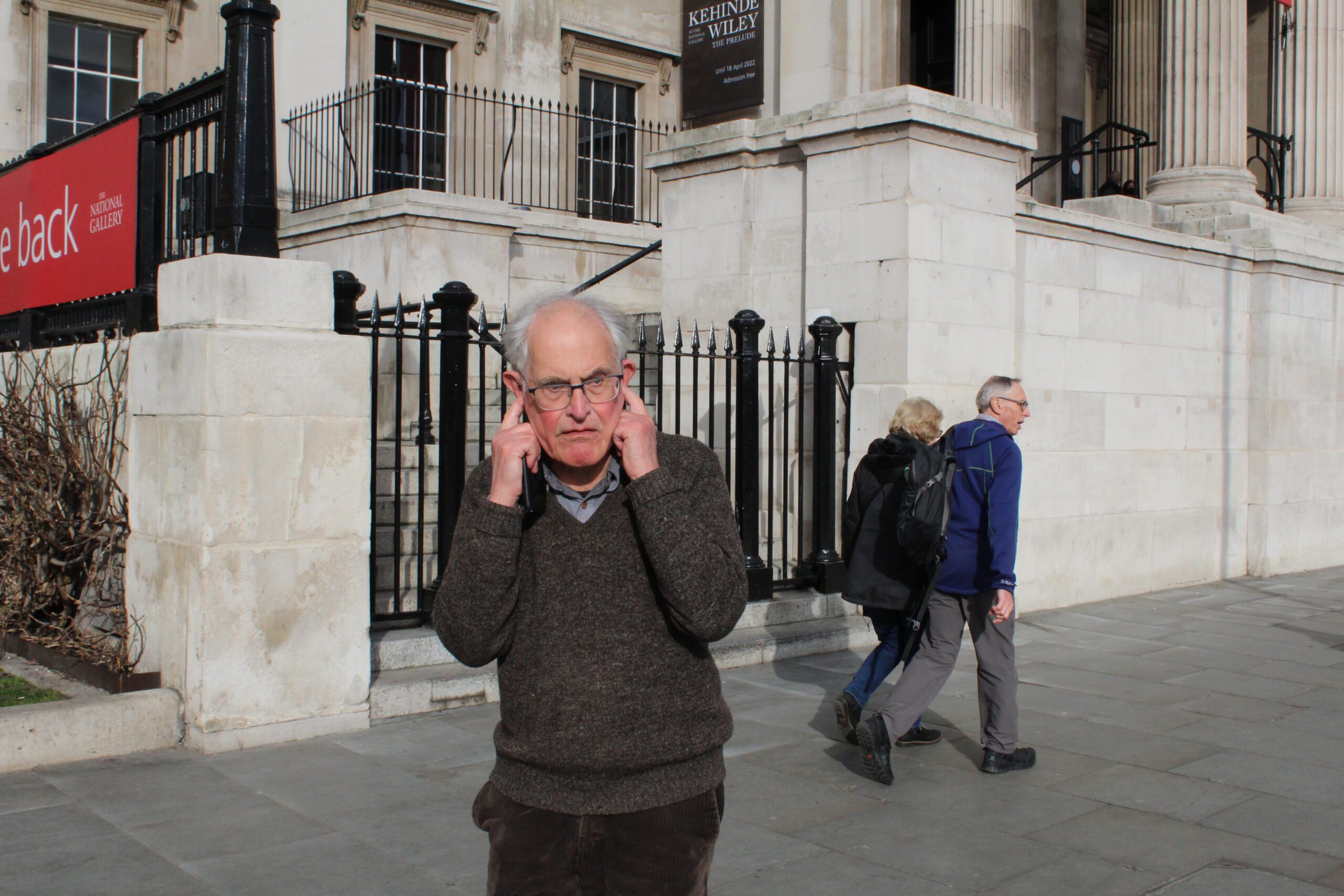 London Street Photography Man Fingers in Ears
